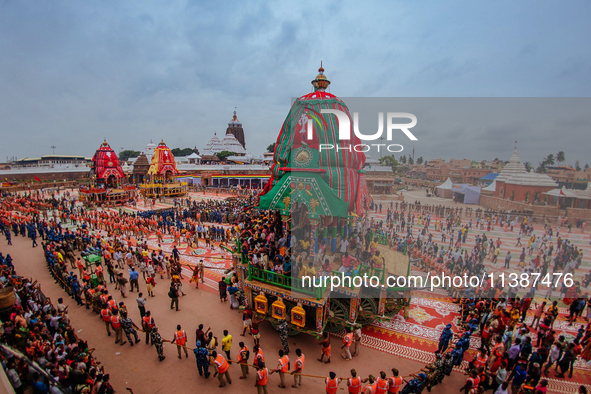 Newly Built Wooden Chariots Of Lord Balabhadra, Devi Subhadra And Lord Jagannath Are Seen In Front Of The Shree Jagannath Temple On The Eve...