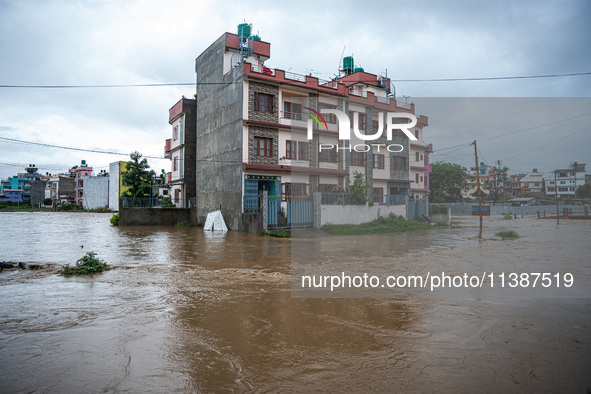 The road in Tikathali, Kathmandu, is flooding after incessant rainfall in Kathmandu, Nepal, on July 06, 2024. 