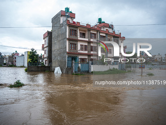 The road in Tikathali, Kathmandu, is flooding after incessant rainfall in Kathmandu, Nepal, on July 06, 2024. (