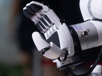 A hand from a humanoid robot is demonstrating its hand movement at the World Artificial Intelligence Conference at the Shanghai World Expo E...