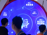 Visitors are walking past a sign of AI information at the World Artificial Intelligence Conference at the Shanghai World Expo Exhibition Cen...