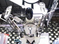 A humanoid robot is demonstrating how to move its hands and legs at the World Artificial Intelligence Conference at the Shanghai World Expo...