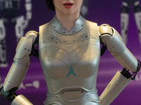 A humanoid robot, created by a team from Qingbao Robot, is greeting people at the World Artificial Intelligence Conference at the Shanghai W...