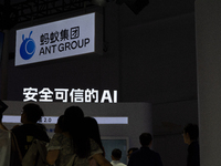 Visitors are being seen at the Ant Group stand at the World Artificial Intelligence Conference at the Shanghai World Expo Exhibition Center...