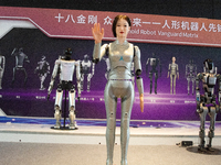 A humanoid robot, created by a team from Qingbao Robot, is greeting people at the World Artificial Intelligence Conference at the Shanghai W...