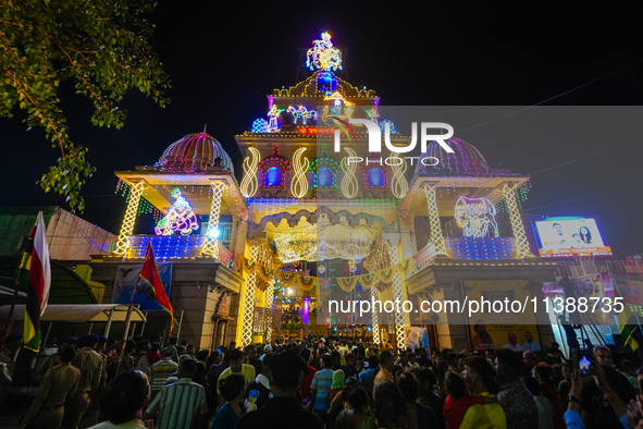 Many devotees are offering prayers at the Jagannath Temple on the eve of Lord Jagannath's 147th Rath Yatra in Ahmedabad, India, on Saturday....