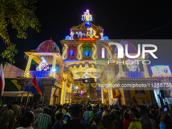 Many devotees are offering prayers at the Jagannath Temple on the eve of Lord Jagannath's 147th Rath Yatra in Ahmedabad, India, on Saturday....