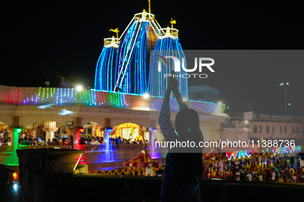 Many devotees are offering prayers at the Jagannath Temple on the eve of Lord Jagannath's 147th Rath Yatra in Ahmedabad, India, on Saturday....