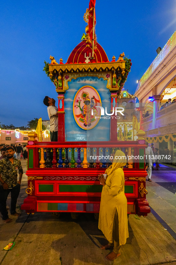 Many devotees are offering prayers at the Jagannath Temple on the eve of Lord Jagannath's 147th Rath Yatra in Ahmedabad, India, on Saturday....