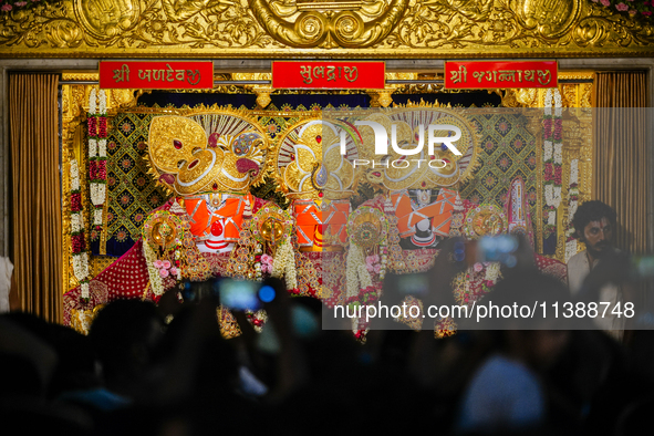 Many devotees are offering prayers at the Jagannath Temple on the eve of Lord Jagannath's 147th Rath Yatra in Ahmedabad, India, on Saturday....