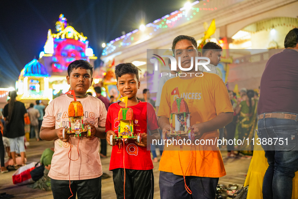 Many devotees are offering prayers at the Jagannath Temple on the eve of Lord Jagannath's 147th Rath Yatra in Ahmedabad, India, on Saturday....