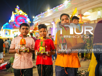 Many devotees are offering prayers at the Jagannath Temple on the eve of Lord Jagannath's 147th Rath Yatra in Ahmedabad, India, on Saturday....