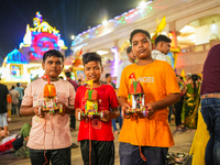 Many devotees are offering prayers at the Jagannath Temple on the eve of Lord Jagannath's 147th Rath Yatra in Ahmedabad, India, on Saturday....