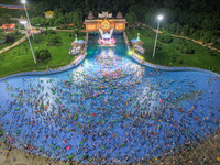 A large number of citizens are cooling off at a water park on the evening of high temperature in Nanjing, China, on July 6, 2024. (