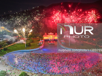 A large number of citizens are watching a fireworks show at a water park during high temperatures in Nanjing, China, on July 6, 2024. (