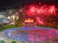 A large number of citizens are watching a fireworks show at a water park during high temperatures in Nanjing, China, on July 6, 2024. (