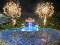 A large number of citizens are watching a fireworks show at a water park during high temperatures in Nanjing, China, on July 6, 2024. (