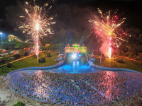 A large number of citizens are watching a fireworks show at a water park during high temperatures in Nanjing, China, on July 6, 2024. (