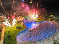 A large number of citizens are watching a fireworks show at a water park during high temperatures in Nanjing, China, on July 6, 2024. (