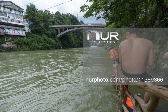 A gate is opening to release floodwater at a power station in Enshi, Hubei province, China, on July 6, 2024. 