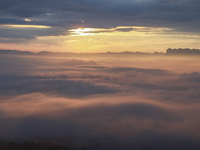 Tourists are watching the sunrise from a viewing platform over the Three Gorges in Yichang, China, on July 7, 2024. (