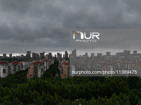 The city of Lianyungang is being covered by dark clouds in Lianyungang, China, on July 7, 2024. 