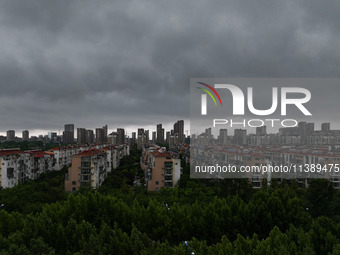 The city of Lianyungang is being covered by dark clouds in Lianyungang, China, on July 7, 2024. (