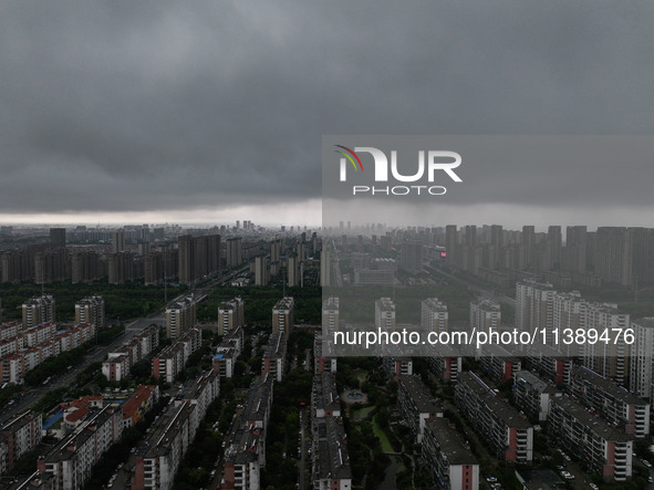 The city of Lianyungang is being covered by dark clouds in Lianyungang, China, on July 7, 2024. 