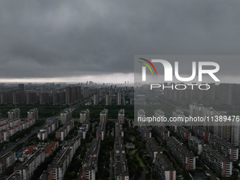 The city of Lianyungang is being covered by dark clouds in Lianyungang, China, on July 7, 2024. (