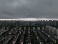 The city of Lianyungang is being covered by dark clouds in Lianyungang, China, on July 7, 2024. (