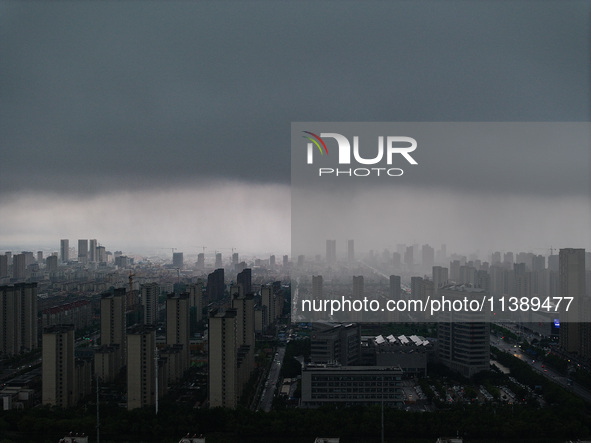 The city of Lianyungang is being covered by dark clouds in Lianyungang, China, on July 7, 2024. 