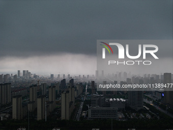 The city of Lianyungang is being covered by dark clouds in Lianyungang, China, on July 7, 2024. (