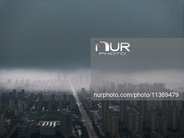 The city of Lianyungang is being covered by dark clouds in Lianyungang, China, on July 7, 2024. 