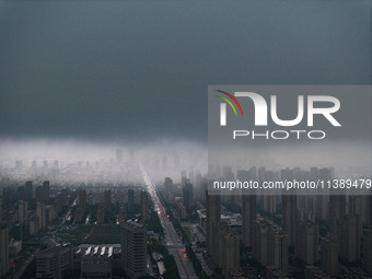 The city of Lianyungang is being covered by dark clouds in Lianyungang, China, on July 7, 2024. (