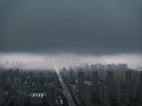 The city of Lianyungang is being covered by dark clouds in Lianyungang, China, on July 7, 2024. (