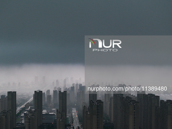 The city of Lianyungang is being covered by dark clouds in Lianyungang, China, on July 7, 2024. 