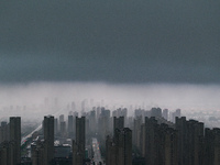 The city of Lianyungang is being covered by dark clouds in Lianyungang, China, on July 7, 2024. (