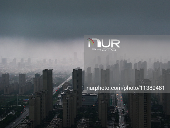 The city of Lianyungang is being covered by dark clouds in Lianyungang, China, on July 7, 2024. 