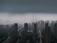 The city of Lianyungang is being covered by dark clouds in Lianyungang, China, on July 7, 2024. (