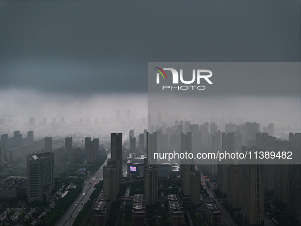 The city of Lianyungang is being covered by dark clouds in Lianyungang, China, on July 7, 2024. 