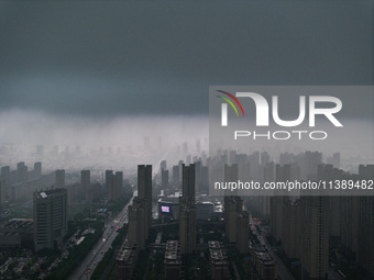 The city of Lianyungang is being covered by dark clouds in Lianyungang, China, on July 7, 2024. (