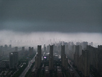 The city of Lianyungang is being covered by dark clouds in Lianyungang, China, on July 7, 2024. (