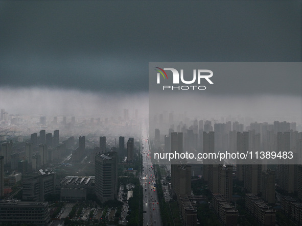 The city of Lianyungang is being covered by dark clouds in Lianyungang, China, on July 7, 2024. 