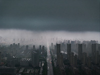 The city of Lianyungang is being covered by dark clouds in Lianyungang, China, on July 7, 2024. (