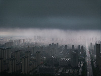 The city of Lianyungang is being covered by dark clouds in Lianyungang, China, on July 7, 2024. (