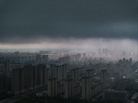 The city of Lianyungang is being covered by dark clouds in Lianyungang, China, on July 7, 2024. (