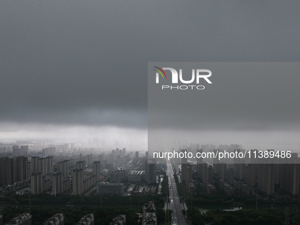 The city of Lianyungang is being covered by dark clouds in Lianyungang, China, on July 7, 2024. 