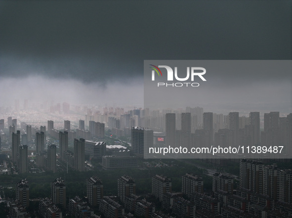 The city of Lianyungang is being covered by dark clouds in Lianyungang, China, on July 7, 2024. 