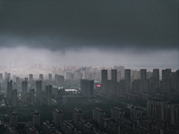 The city of Lianyungang is being covered by dark clouds in Lianyungang, China, on July 7, 2024. (