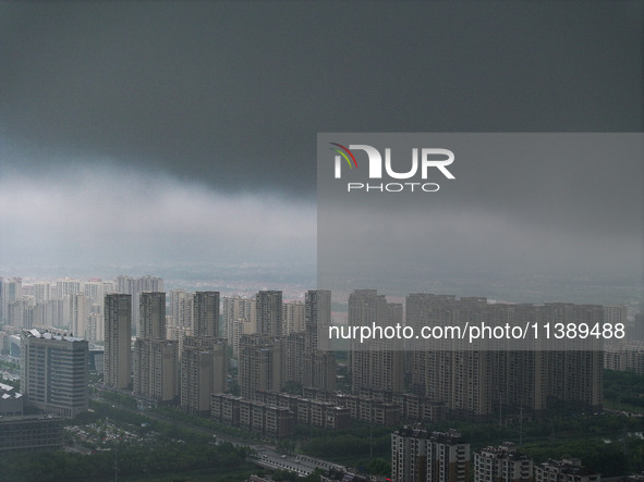 The city of Lianyungang is being covered by dark clouds in Lianyungang, China, on July 7, 2024. 